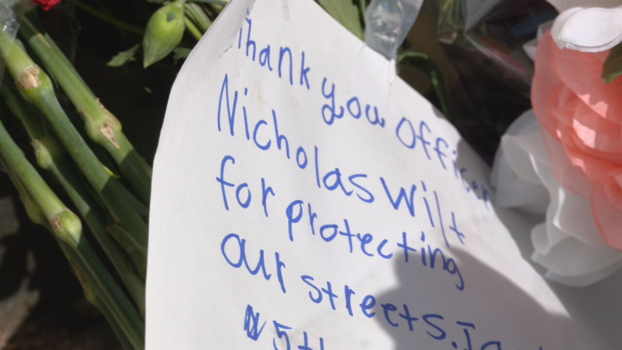 IMAGES | Crosses, notes, flowers part of growing memorial at site of Louisville mass shooting